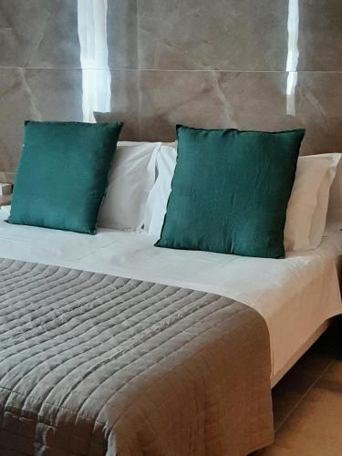 Katil atau katil-katil dalam bilik di BAARIA House Hotel