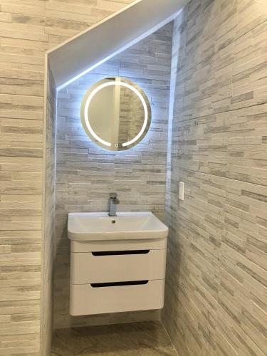 a bathroom with a sink and a mirror at 232B South Finger in Jolly Harbour