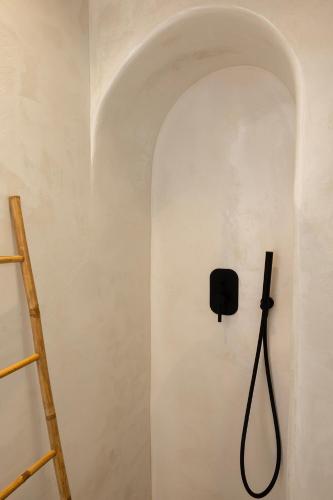 a wall with a black box on a wall at Mykonos Alley Stars - Secret Khora - 360 View in Mýkonos City
