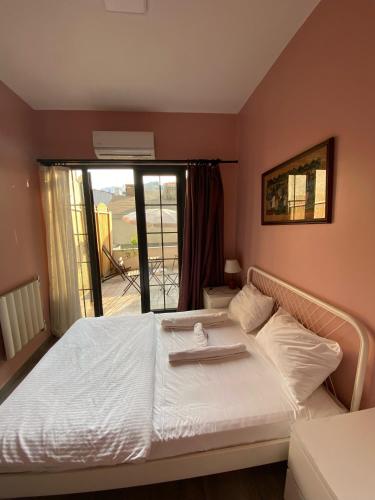 a bedroom with a bed with a tray on it at Archeo in Istanbul