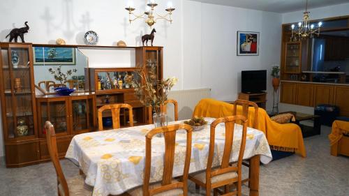 a dining room with a table and chairs at VILLA KONSTADINE in Asprovalta