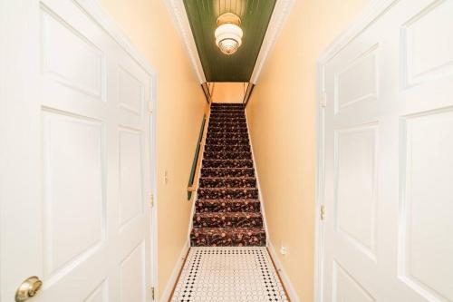 an empty staircase in a house with an open door at The Long Run - 2 CA King Sized Beds+ - Sleeps 8-10 in Lynchburg