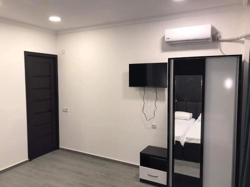 TV a/nebo společenská místnost v ubytování Hotel Niko