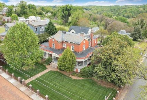 an aerial view of a large red brick house at Desperado - CA King Size Bed - Sleeps 2-4 in Lynchburg