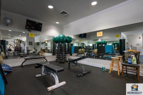 a gym with exercise equipment and balloons on the wall at 1BR Walk-In Condo at Pointe Royal - 2 Pools - FREE TICKETS INCLUDED - PR40-9 in Branson