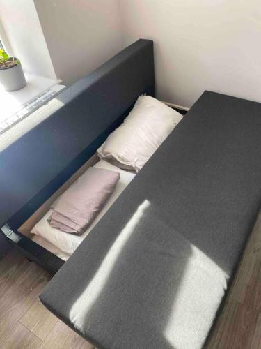 a bunk bed with two pillows next to a table at Lovely 1 Bedroom apartment in Dublin 1 in Dublin