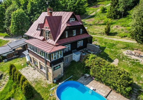 an aerial view of a house with a pool at Horská Chata Gírová in Bukovec