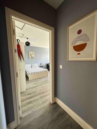 a hallway with a door leading to a living room at Lovely Studio in Dublin City Centre in Dublin