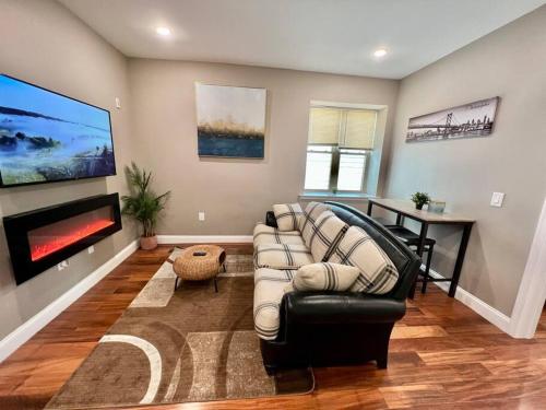 a living room with a couch and a tv at 505 Relaxing 1BR apartment in center city of Philly in Philadelphia