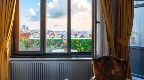 a room with a window with a view of a city at Santa Rio Taxim in Istanbul