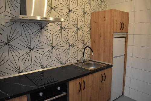 Η κουζίνα ή μικρή κουζίνα στο Rua 82 Apartamentos