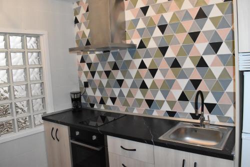 Η κουζίνα ή μικρή κουζίνα στο Rua 82 Apartamentos