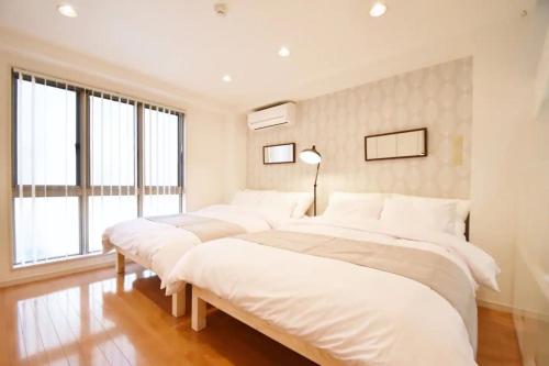 Giường trong phòng chung tại TERRACE HOUSE Shibuya Maruyamacho - Vacation STAY 79338v