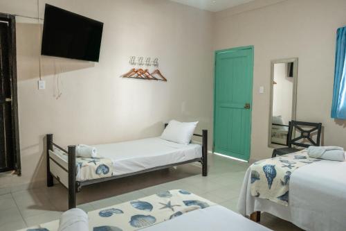 Katil atau katil-katil dalam bilik di Hotel Pelicano