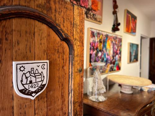 a wooden door with a sticker on it in a room at LA GASSINIÈRE in Gassin