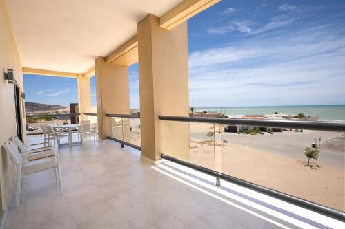 a balcony with a view of the beach at Laguna Shores Resort in Puerto Peñasco