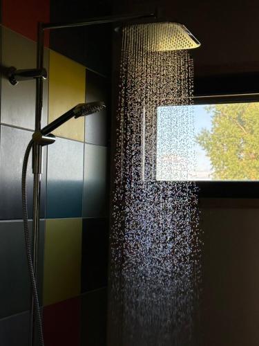 a shower in a bathroom with a shower curtain at PeltoVilla in Tyrnävä