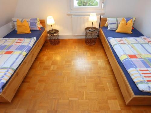 Кровать или кровати в номере Ferienhaus in Rietheim