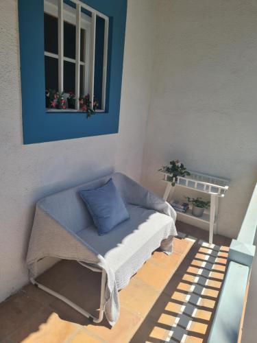 a small room with a couch and a window at Cozy Studio Sea View in Chayofa in Chayofa