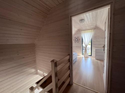 an inside view of a room with a sauna at Malaga in Gąski