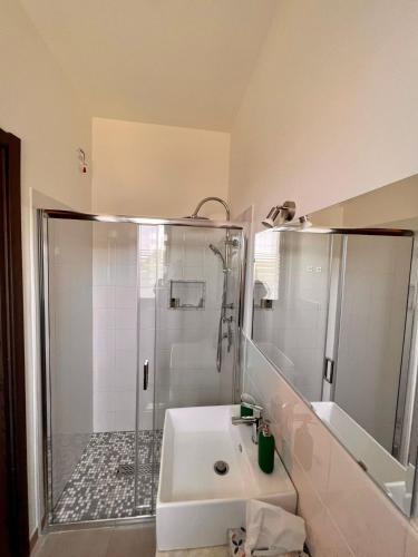 a bathroom with a shower and a sink at Cristian Rooms in Avola