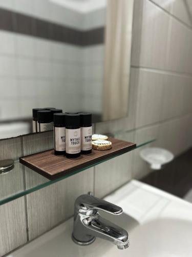 a bathroom with a sink and a mirror and a sink at Βαδόκειος ΓΗ in Zítsa