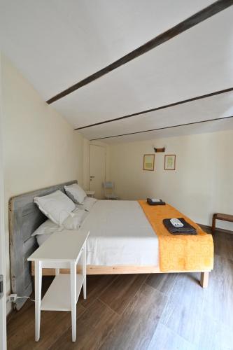 Postel nebo postele na pokoji v ubytování CASCINA BINELLO appartamento B