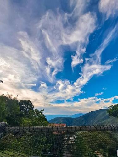 a view of a blue sky with clouds at La Peña Cabins - Ebéjico in Ebéjico