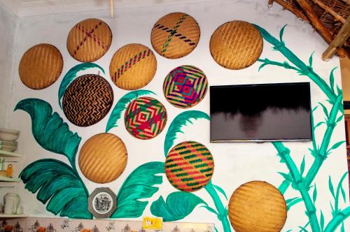 a wall with painted basketballs on it at Palm Tree Villa Nungwi in Nungwi