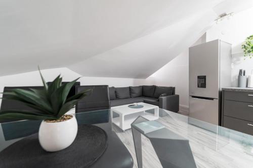 a living room with a couch and a table at City Center Mayess Aparment in Zadar