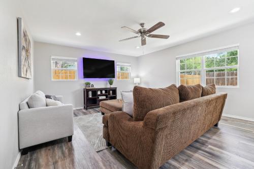 a living room with a couch and a chair at Spacious San Antonio Retreat with Private Patio! in San Antonio