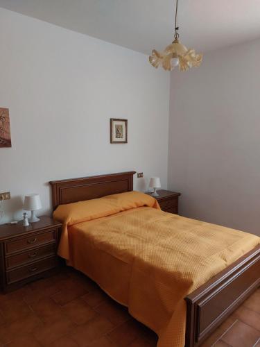 a bedroom with a bed and two night stands at Un angolo di tranquillità 