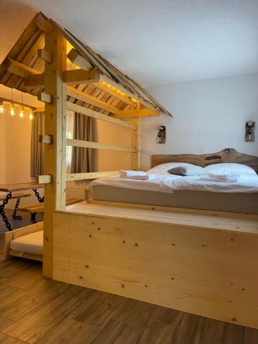 a bedroom with two bunk beds and a desk at Mama Mia Apartments in Radovljica