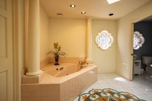 a large bathroom with a tub with a plant in it at Mountainview Escape in Borrego Springs
