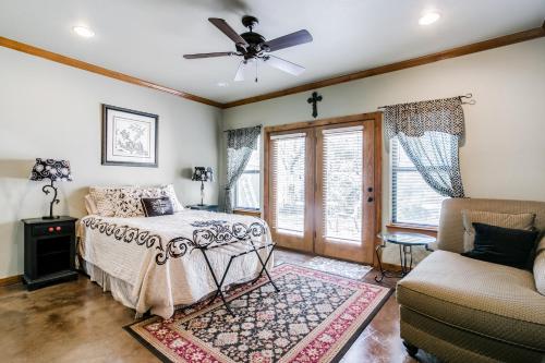 a bedroom with a bed and a ceiling fan at Sunset Retreat in Whitney