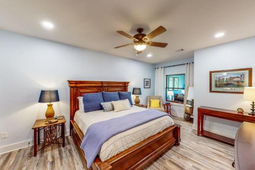 a bedroom with a bed and a ceiling fan at Abruzzi - Villa A in Eatonton 