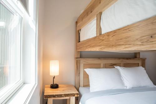 a bedroom with a bunk bed and a window at Mountain Dreams - Revelstoke Home Near RMR in Revelstoke