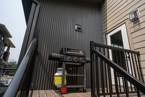 a hot dog cooker on the side of a house at Mountain Dreams - Revelstoke Home Near RMR in Revelstoke