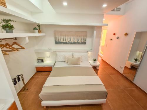 a bedroom with a large bed in a room at Don Antonio Rooms in Agropoli