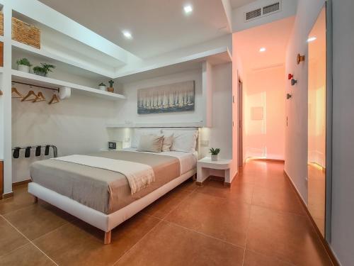 a bedroom with a large bed in a room at Don Antonio Rooms in Agropoli