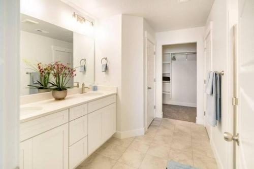 a white bathroom with a sink and a mirror at NEW 4-bed 4-bath Stylish House with Mountain View and 2 garages in Lehi