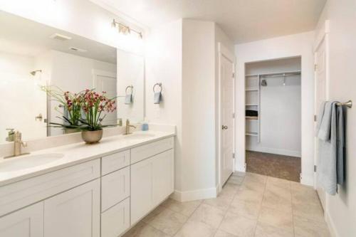 a white bathroom with a sink and a mirror at NEW 4-bed 4-bath Stylish House with Mountain View and 2 garages in Lehi