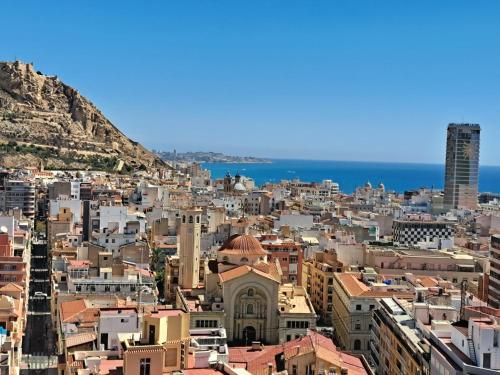 a view of a city with buildings and the ocean at Mirador in Alicante