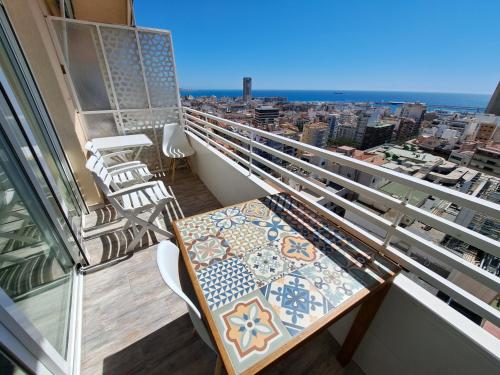a balcony with a table and chairs on it at Mirador in Alicante