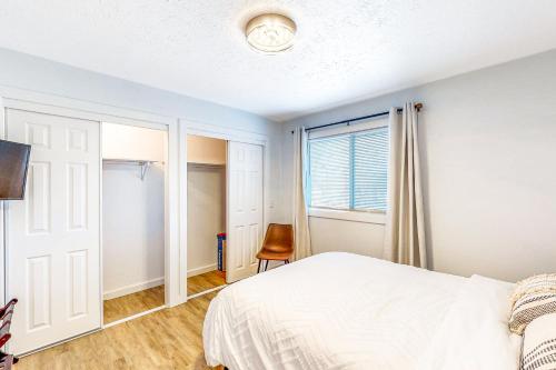 a bedroom with a bed and a window at The Jewel of Elkhart, Upper Unit in Elkhart
