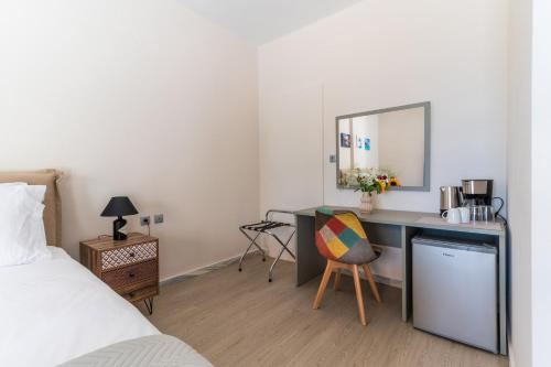 Ένα ή περισσότερα κρεβάτια σε δωμάτιο στο Cape Blue Suites