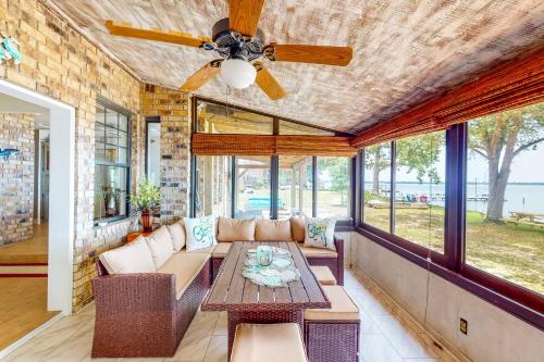 a living room with a couch and a table at Get a Wave From it All in Pensacola