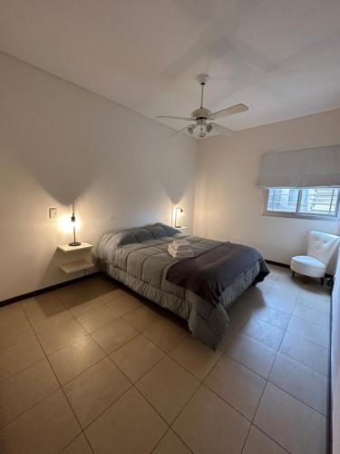 מיטה או מיטות בחדר ב-Departamento Quinta N