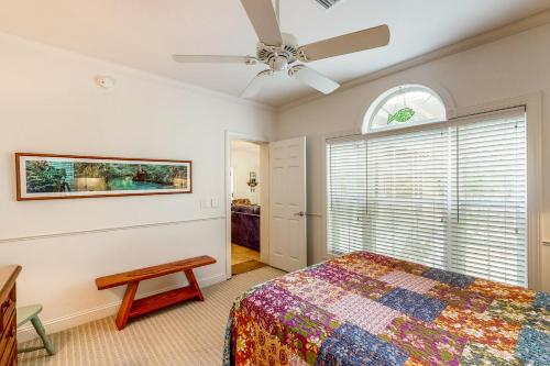 a bedroom with a bed and a ceiling fan at River Watcher in Bell