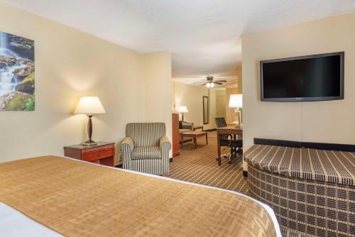 a hotel room with two beds and a flat screen tv at Best Western Plus Bridgeport Inn in Bridgeport